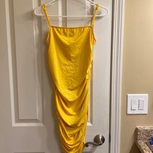 Yellow, tight dress. Synching on sides (option to make shorter/longer)